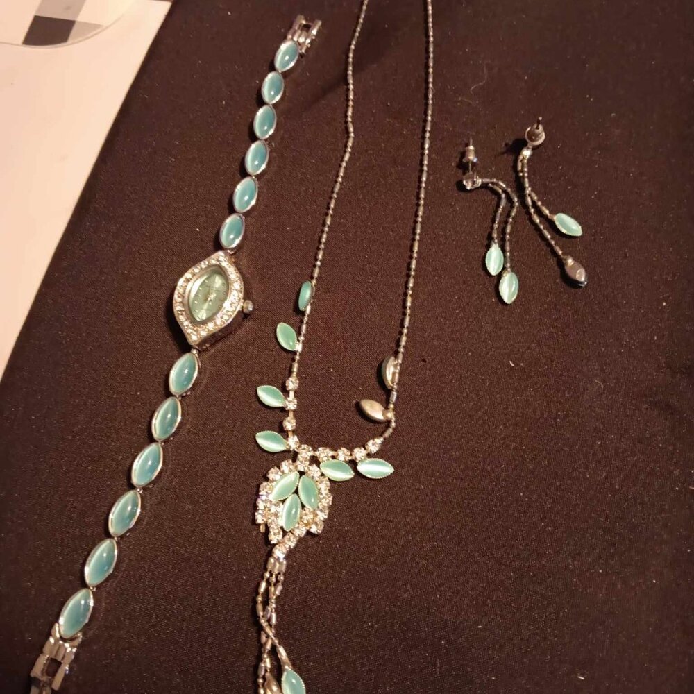 aqua and silver necklace, earrings and watch